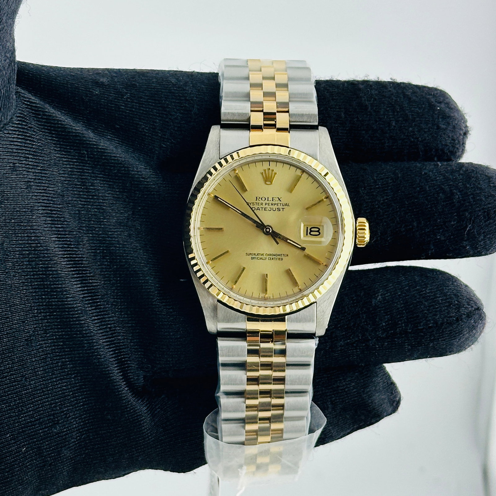 Rolex Datejust 16013 Champagne Stick Dial Aftermarket Jubilee Bracelet: Rolex Datejust 16013 Champagne Stick Dial Aftermarket Jubilee Bracelet This Rolex Datejust features a champagne stick dial and is paired with an aftermarket Jubilee bracelet. The watch includes a flut