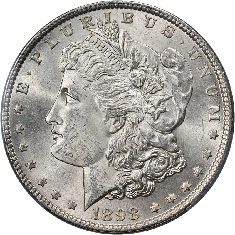 PCGS MS63 1898 Philadelphia Morgan Dollar Uncirculated Silver Coin: PCGS MS63 1898 Philadelphia Morgan Dollar Uncirculated Silver Coin The 1898-P Morgan Silver Dollar is an uncirculated coin graded MS63 by PCGS, noted for its strong strike and impressive luster. Compo