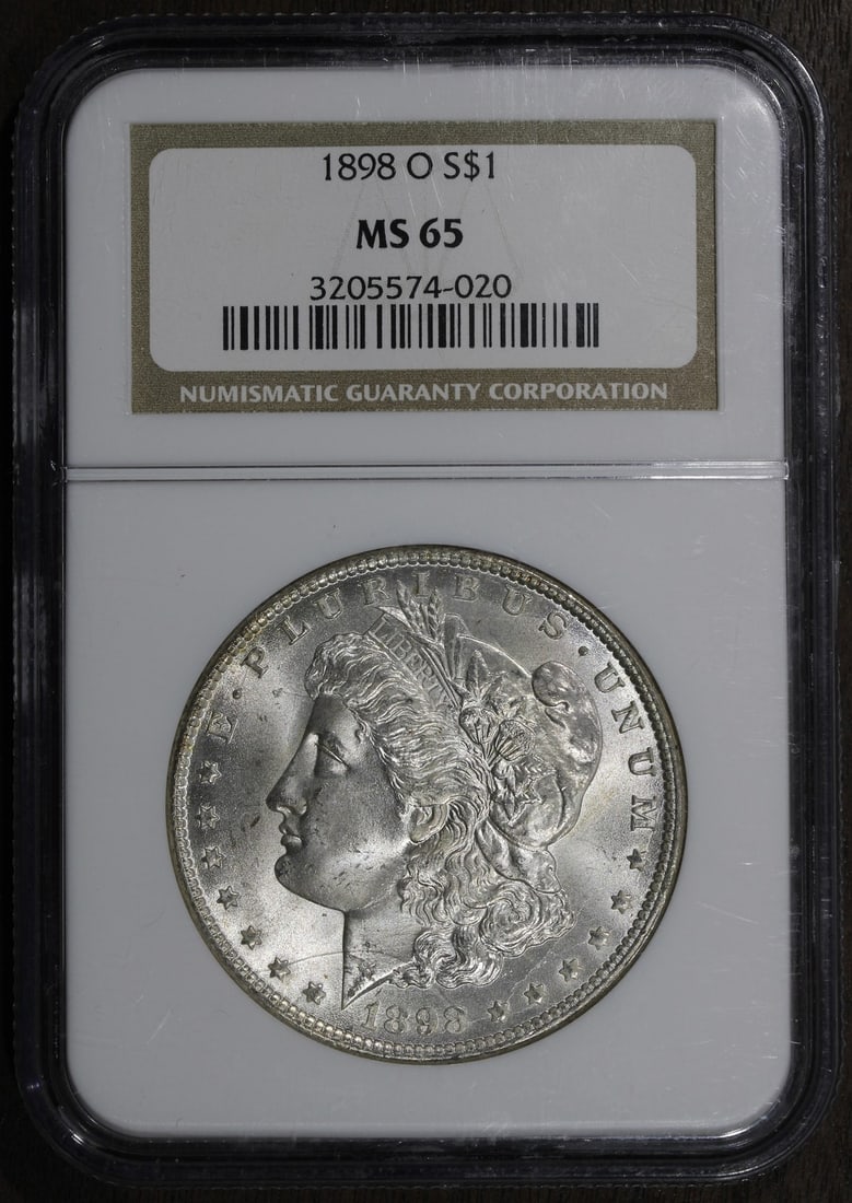 NGC MS65 1898 O Morgan Silver Dollar Gem $1: NGC MS65 1898 O Morgan Silver Dollar Gem $1 1898-O Morgan Silver Dollar graded MS65 by Numismatic Guaranty Company (NGC). This United States $1 coin is composed of silver with 0.9 fineness and was min