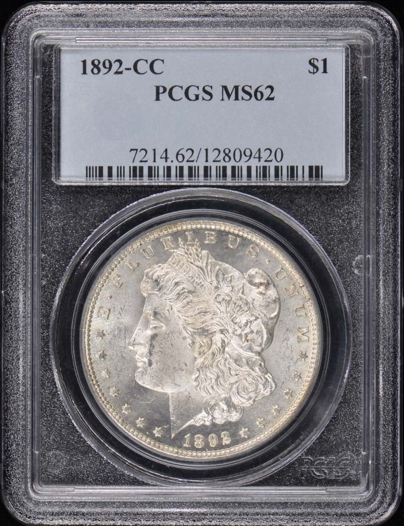 1892-CC $1 Morgan Dollar Uncirculated PCGS MS62 Coin: 1892-CC $1 Morgan Dollar Uncirculated PCGS MS62 Coin This 1892-CC Morgan Dollar is a stunning example of numismatic artistry, certified by PCGS with a grade of MS62. Struck at the Carson City Mint, th