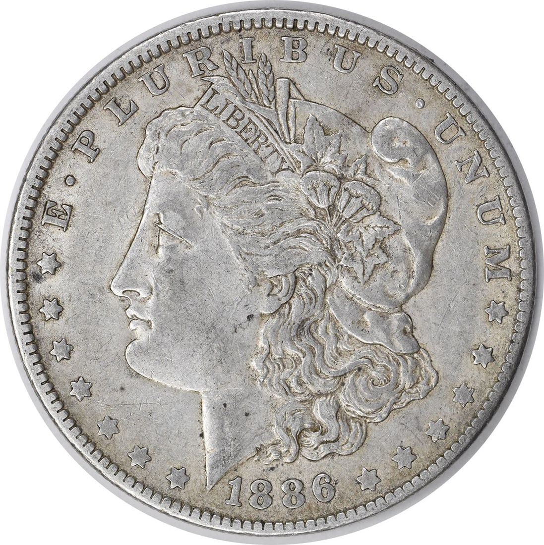 1886-O Morgan Silver Dollar XF Uncertified New Orleans Coin: 1886-O Morgan Silver Dollar XF Uncertified New Orleans Coin This 1886-O Morgan Silver Dollar, a cherished piece of numismatic history, features a rich silver composition of 90% silver and 10% copper. 