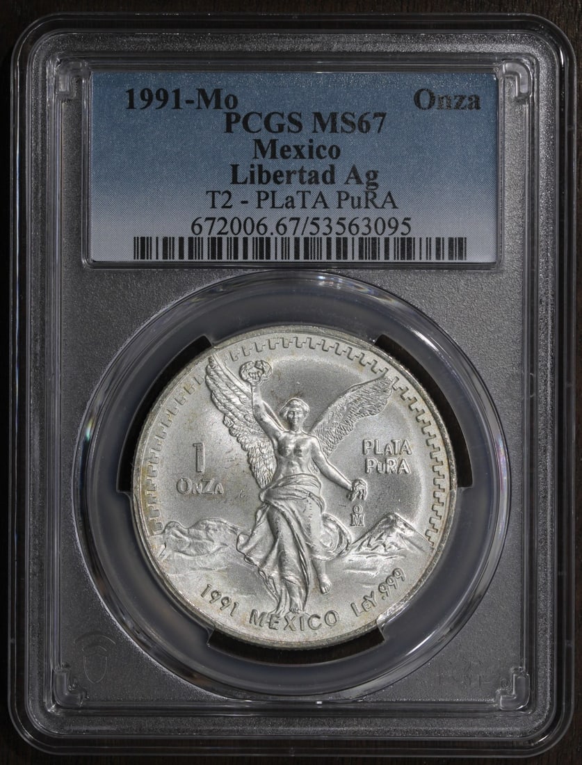 1991 Mexico Libertad 1 oz Silver PCGS MS67 Type 2 Key Date: 1991 Mexico Libertad 1 oz Silver PCGS MS67 Type 2 Key Date This is a 1991 Mexican Libertad 1 oz silver coin, graded MS67 by PCGS. Struck in .999 fine silver, this Type 2 Libertad is considered a key d