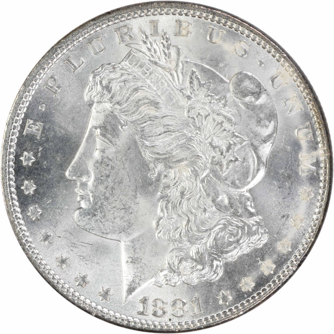 1881 Uncertified Morgan Silver Dollar MS63 Philadelphia: 1881 Uncertified Morgan Silver Dollar MS63 Philadelphia An 1881 Morgan Silver Dollar in Choice BU condition, uncertified and uncirculated. This United States coin has a $1 denomination, was designed b