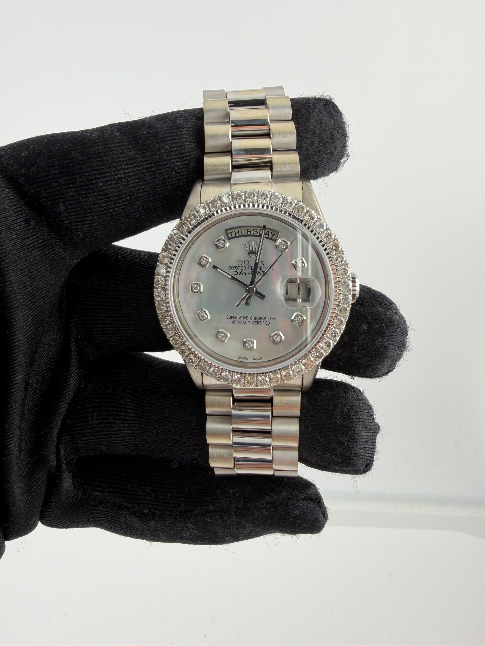Rolex Day Date Ref 1803 MOP Diamond Aftermarket Dial with 14K President Bracelet: Rolex Day Date Ref 1803 MOP Diamond Aftermarket Dial with 14K President Bracelet This Rolex Day Date men's watch features a Mother of Pearl (MOP) dial adorned with diamond hour markers. It is equipped