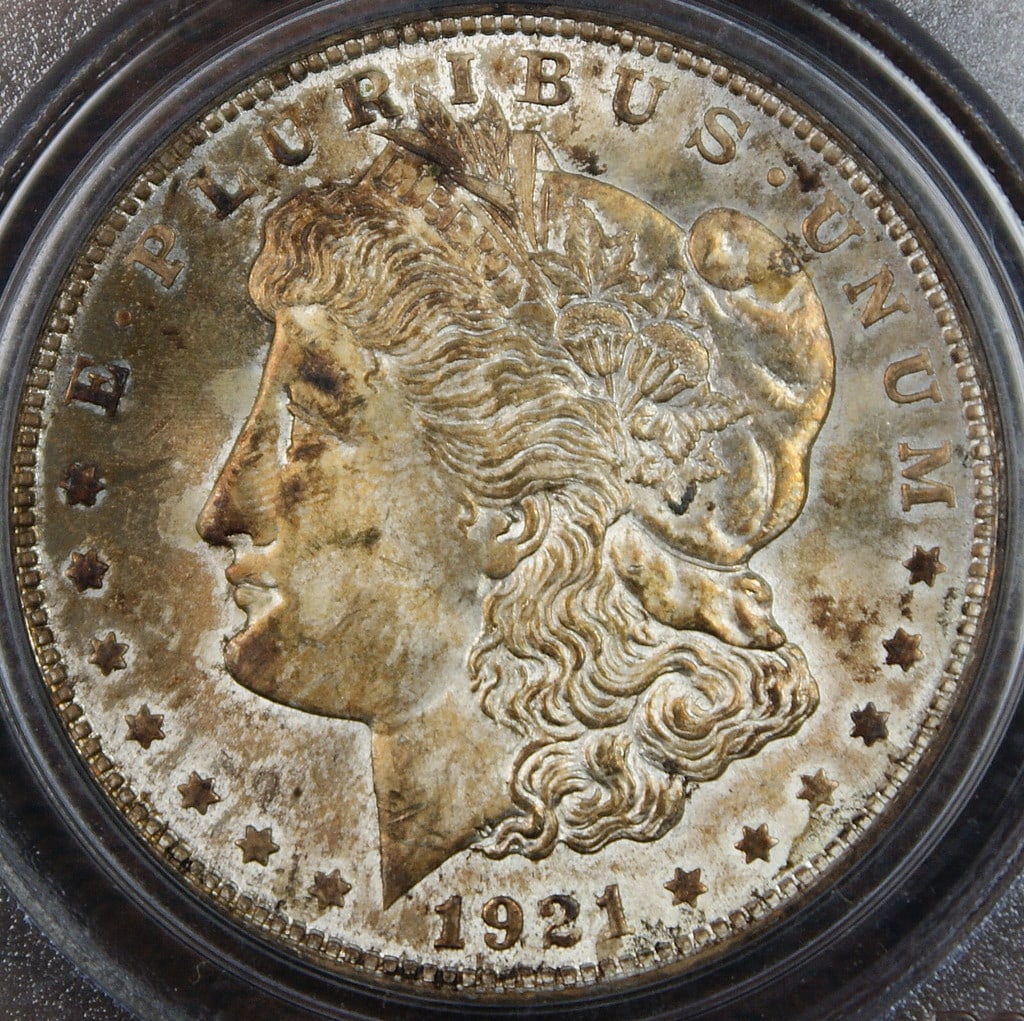 PCGS MS63 1921 Morgan Dollar Toned Silver Coin: PCGS MS63 1921 Morgan Dollar Toned Silver Coin This 1921 Morgan Silver Dollar coin is certified by PCGS with a grade of MS-63 and features attractive toning. Struck in Philadelphia, it is composed of 
