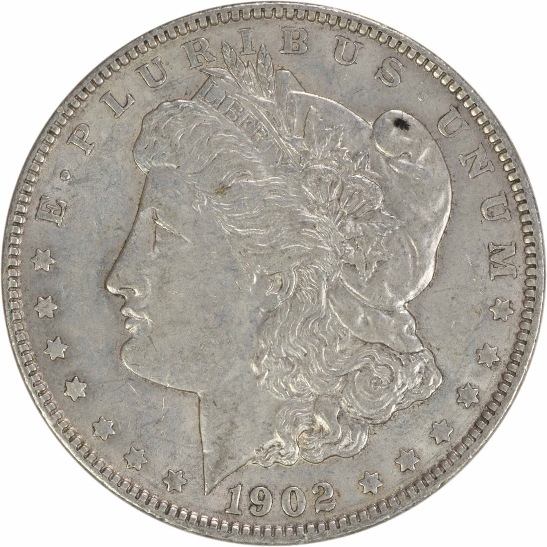 1902 Morgan Silver Dollar AU Uncertified Philadelphia Mint Coin: 1902 Morgan Silver Dollar AU Uncertified Philadelphia Mint Coin This 1902 Morgan Silver Dollar is an exceptional piece for collectors, showcasing the artistry of designer George T. Morgan. The coin is