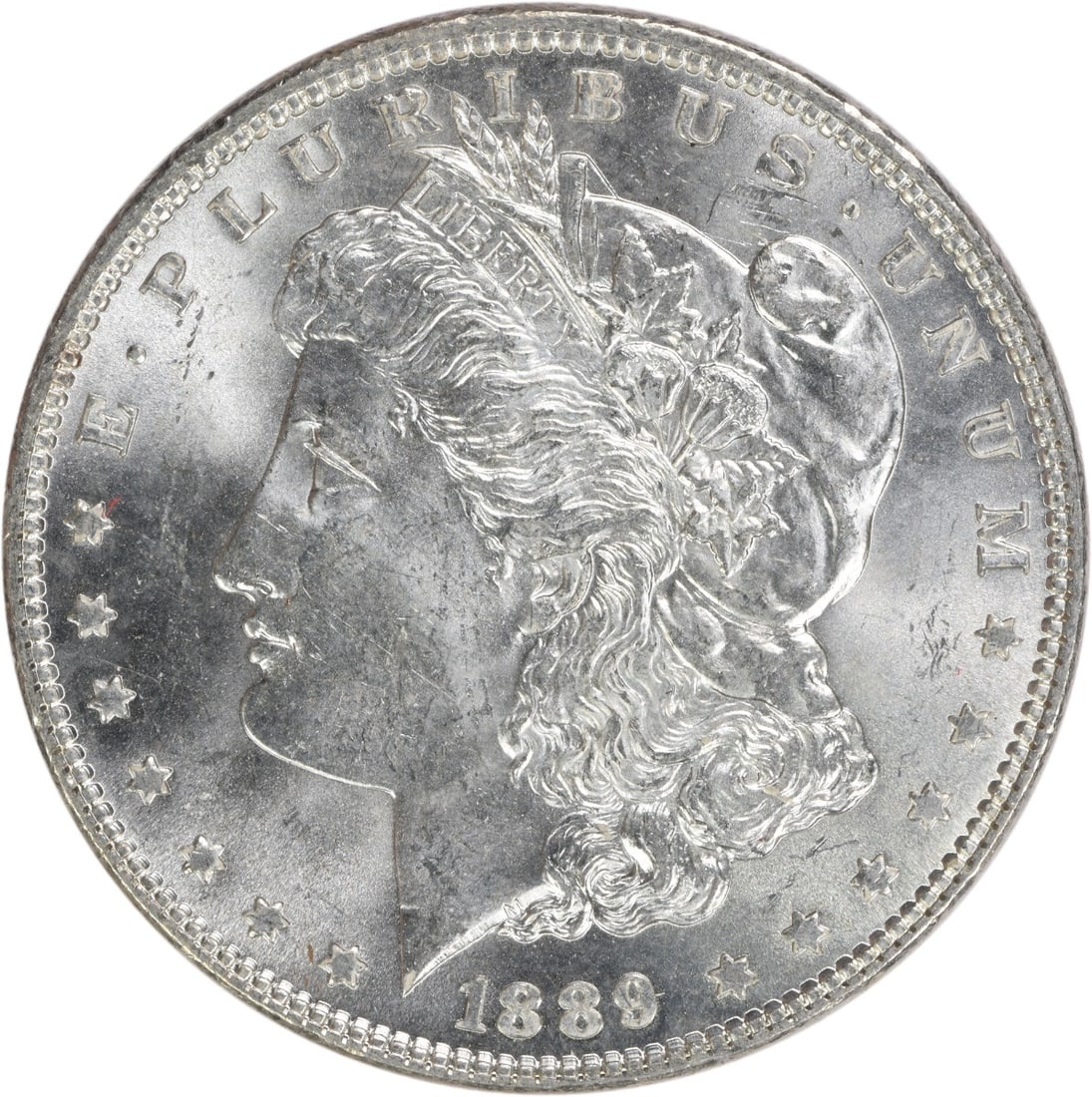 Choice BU 1889 Silver Morgan Dollar Uncirculated Uncertified No Mint Mark: Choice BU 1889 Silver Morgan Dollar Uncirculated Uncertified No Mint Mark This 1889 Morgan Silver Dollar is a Choice BU (Brilliant Uncirculated) coin from the United States. Struck in silver and featu
