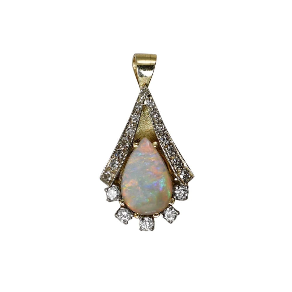 Vintage 14K Yellow Gold Opal Diamond Charm Pendant: Vintage 14K Yellow Gold Opal Diamond Charm Pendant This vintage pendant features a pear-shaped Australian opal set in a 14k gold setting, with the back crafted in yellow gold and the diamond-accented 