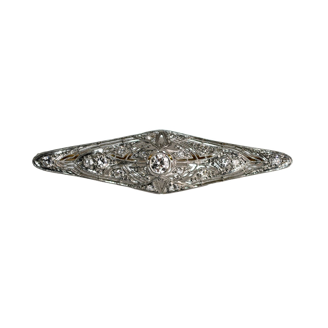 Art Deco Platinum Diamond Brooch 2 in H VS-SI: Art Deco Platinum Diamond Brooch 2 in H VS-SI This antique Art Deco brooch features a platinum setting adorned with old European cut diamonds totaling approximately 0.75 carats. The diamonds are H col