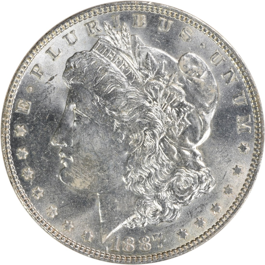 Uncirculated 1887 Silver Dollar Morgan BU Philadelphia No Mint Mark: Uncirculated 1887 Silver Dollar Morgan BU Philadelphia No Mint Mark This 1887 Morgan Silver Dollar is an uncirculated coin, featuring a brilliant uncirculated (BU) grade. Composed of silver, it was mi