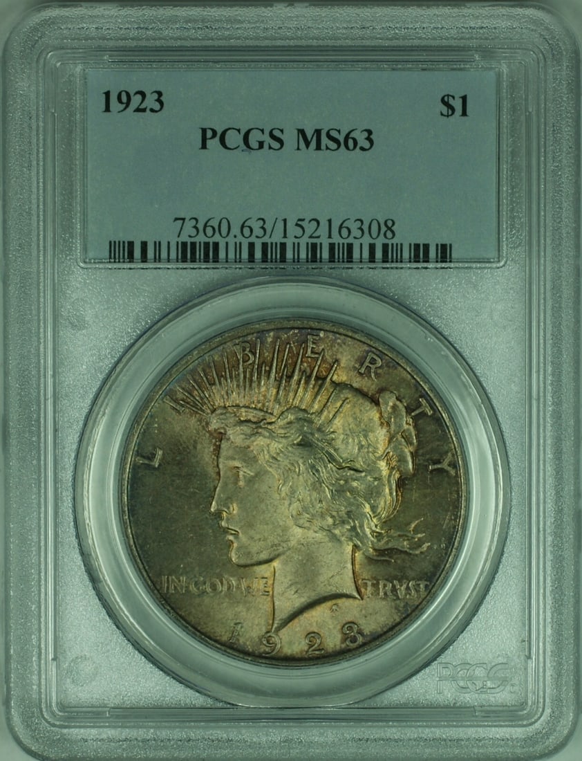 1923 Peace Dollar Uncirculated Silver Coin PCGS MS63 with Attractive Toning: 1923 Peace Dollar Uncirculated Silver Coin PCGS MS63 with Attractive Toning This 1923 Peace Silver Dollar is certified by PCGS with a grade of MS-63. The coin features attractive overall toning and wa
