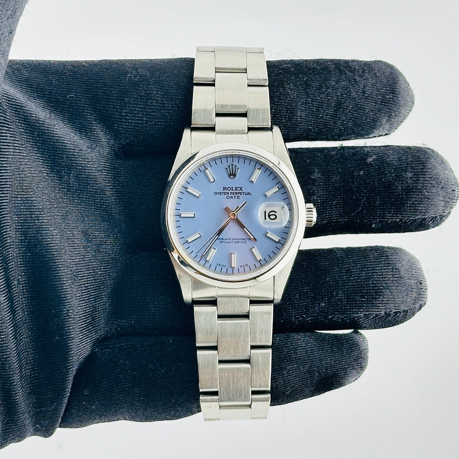 Rolex Oyster Perpetual Date 15200 Aftermarket Lavender Dial Oyster Bracelet: Rolex Oyster Perpetual Date 15200 Aftermarket Lavender Dial Oyster Bracelet This Rolex Oyster Perpetual Date features a distinctive Aftermarket lavender dial, complemented by a smooth bezel and an Oys