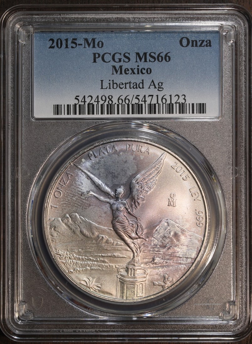 PCGS MS66 2015-Mo Mexico 1 oz Silver Libertad Coin Purple Toning: PCGS MS66 2015-Mo Mexico 1 oz Silver Libertad Coin Purple Toning 2015 Mexico 1 oz Silver Libertad Onza coin certified by PCGS and graded MS 66. It is composed of 0.999 fine silver, was struck by the M