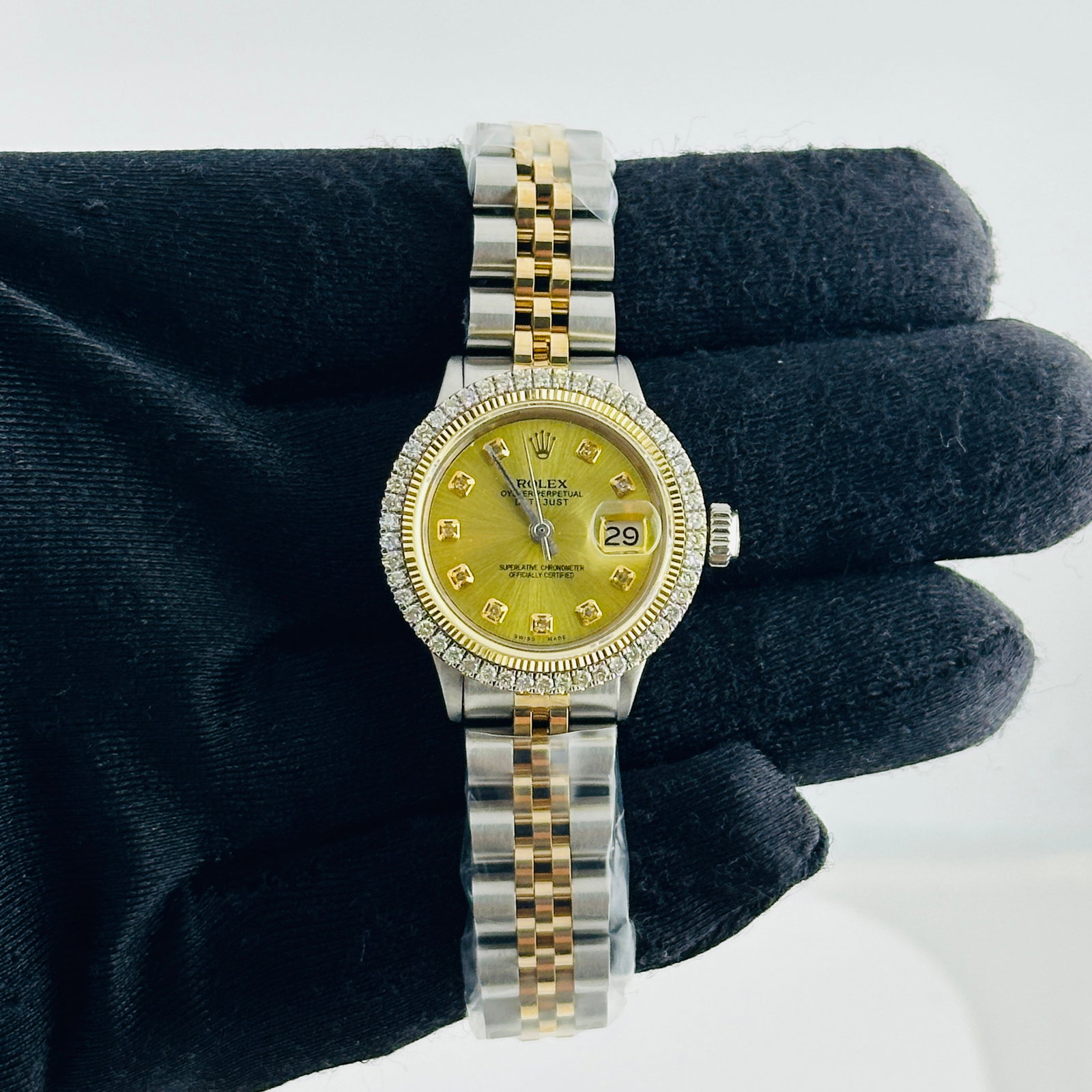 Ladies Rolex Datejust 6517 Champagne Dial Diamond Markers Jubilee Bracelet: Ladies Rolex Datejust 6517 Champagne Dial Diamond Markers Jubilee Bracelet This is a ladies' Rolex Datejust watch featuring an aftermarket champagne dial with yellow diamond markers. The watch include