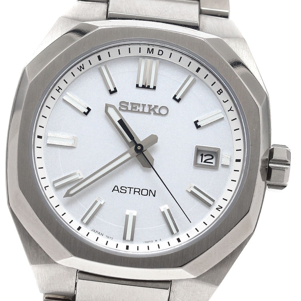 SEIKO Astron Nextar Titanium Solar Radio Controlled Date Wristwatch: SEIKO Astron Nextar Titanium Solar Radio Controlled Date Wristwatch This Seiko Astron Nextar men's wristwatch features a white dial housed in a titanium case and paired with a matching titanium bracel