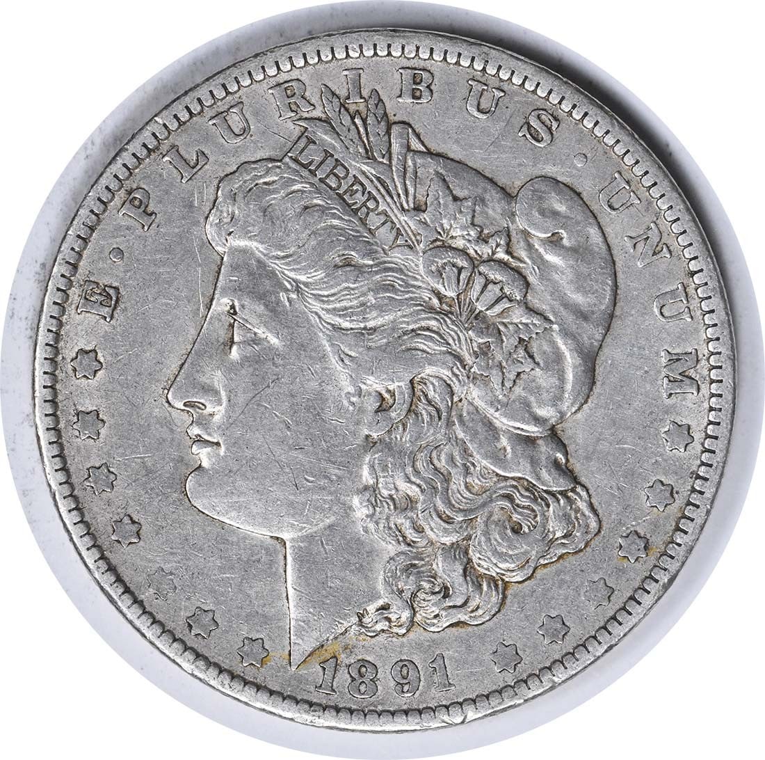 1891-O Morgan Silver Dollar Choice EF Uncertified George T. Morgan Design: 1891-O Morgan Silver Dollar Choice EF Uncertified George T. Morgan Design This 1891-O Morgan Silver Dollar is a remarkable piece of American numismatic history. Featuring a design by George T. Morgan,