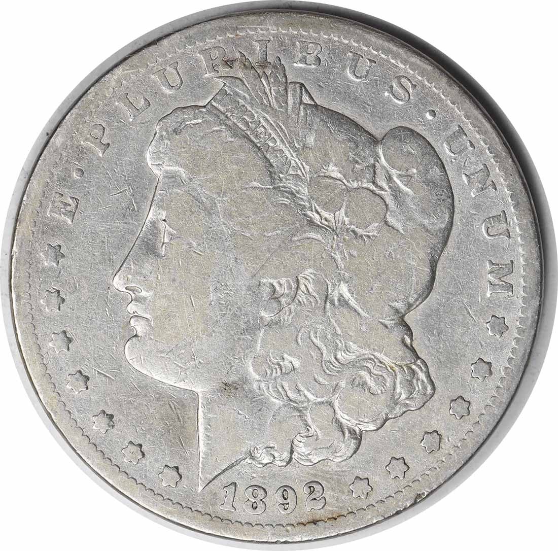 1892-CC Morgan Silver Dollar VG Uncertified Coin 90% Silver: 1892-CC Morgan Silver Dollar VG Uncertified Coin 90% Silver This 1892-CC Morgan Silver Dollar is a classic piece of American numismatic history. Struck at the Carson City Mint, this coin features the 
