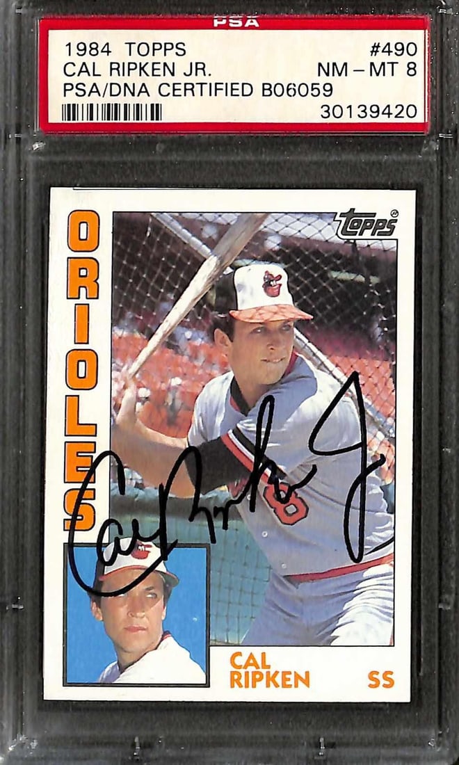 PSA DNA 1984 Topps Cal Ripken Jr Orioles autograph card NM MT 8: PSA DNA 1984 Topps Cal Ripken Jr Orioles autograph card NM MT 8 This is an original 1984 Topps #490 Cal Ripken Jr. baseball trading card featuring the Baltimore Orioles legend. The card is hand-signed