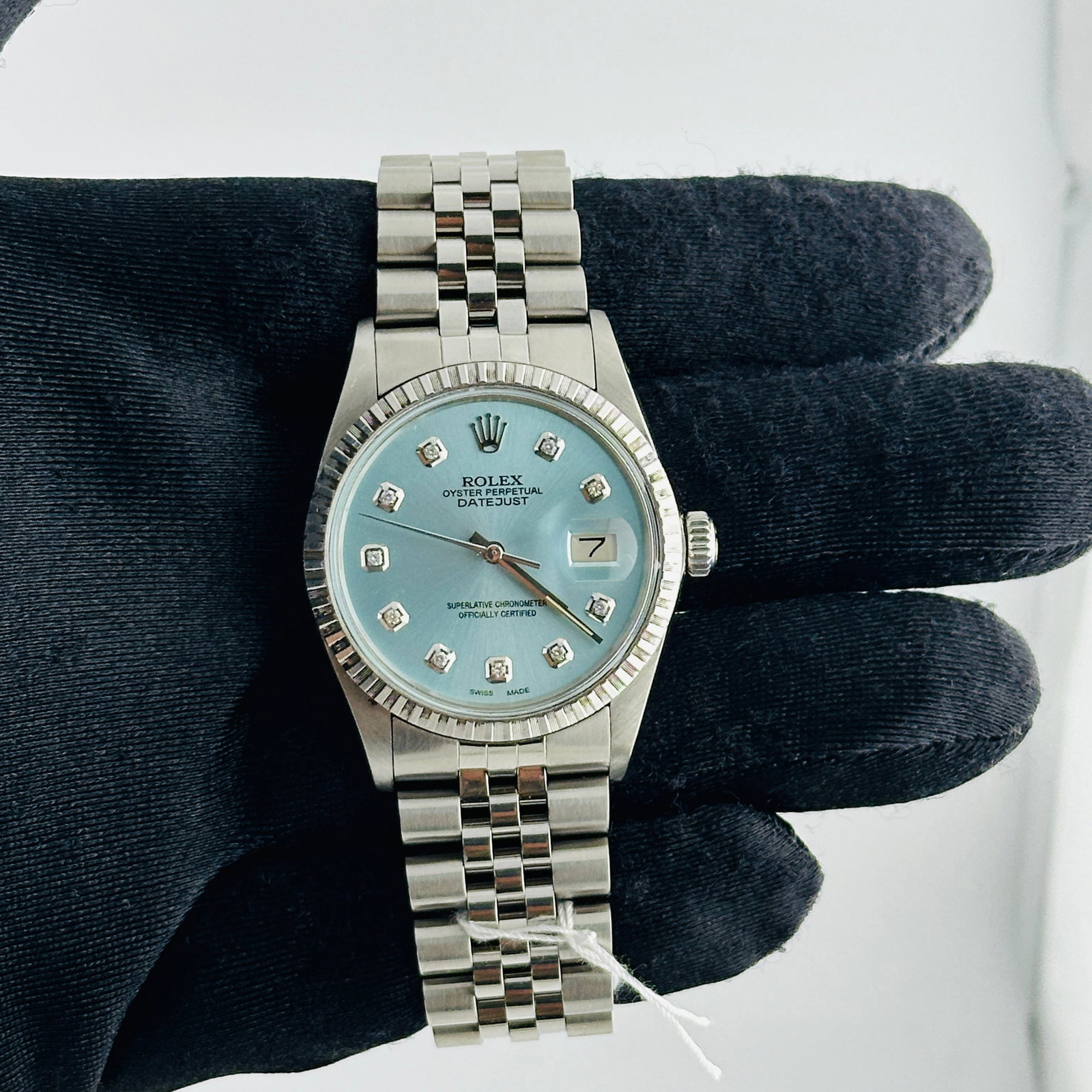 Rolex Datejust 16030 Mens Watch Aftermarket Ice Blue Diamond Dial Jubilee Bracelet: Rolex Datejust 16030 Mens Watch Aftermarket Ice Blue Diamond Dial Jubilee Bracelet This Rolex Datejust features an aftermarket pink palm motif diamond dial, complemented by an engine-turned bezel and 