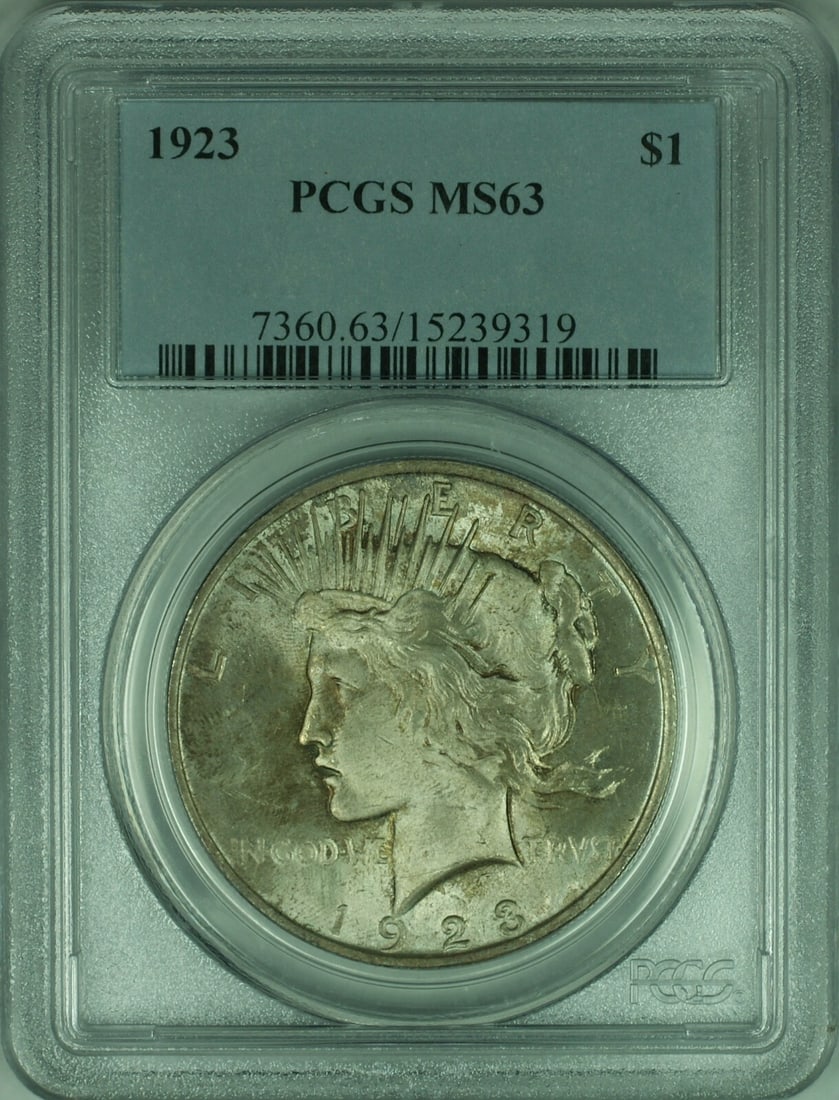 PCGS MS63 1923 Peace Dollar Silver Coin with Attractive Toning: PCGS MS63 1923 Peace Dollar Silver Coin with Attractive Toning This 1923 Peace Silver Dollar is certified by PCGS with a grade of MS-63, indicating it is in uncirculated condition. The coin features a
