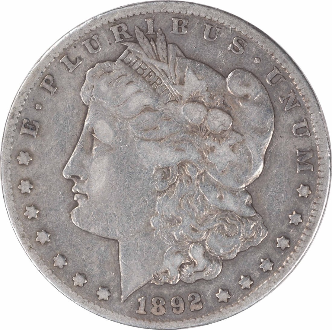 1892-CC Morgan Silver Dollar VF Uncertified Carson City Coin: 1892-CC Morgan Silver Dollar VF Uncertified Carson City Coin This 1892-CC Morgan Silver Dollar, with a vintage grade of Very Fine (VF), is an exquisite piece of numismatic history. Struck at the Carso