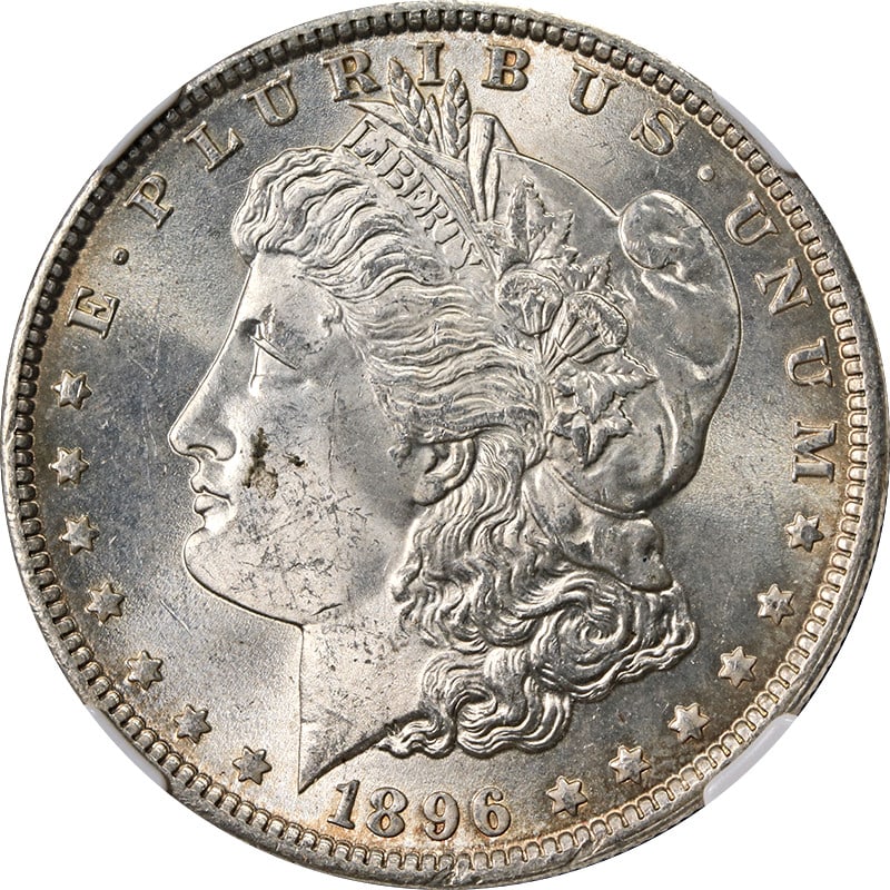 NGC MS63 1896 Philadelphia Morgan Dollar with Toned Surfaces: NGC MS63 1896 Philadelphia Morgan Dollar with Toned Surfaces This 1896-P Morgan Silver Dollar is graded MS63 by NGC and features attractive toning. Struck at the Philadelphia Mint, it is composed of 9