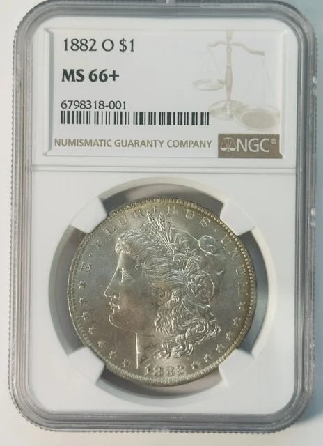 NGC MS-66+ 1882 O Morgan Dollar Silver USA Coin: NGC MS-66+ 1882 O Morgan Dollar Silver USA Coin 1882 O Morgan Silver Dollar certified by NGC and graded MS-66+. The coin is composed of silver, dated 1882, and struck at the New Orleans Mint. It is a 