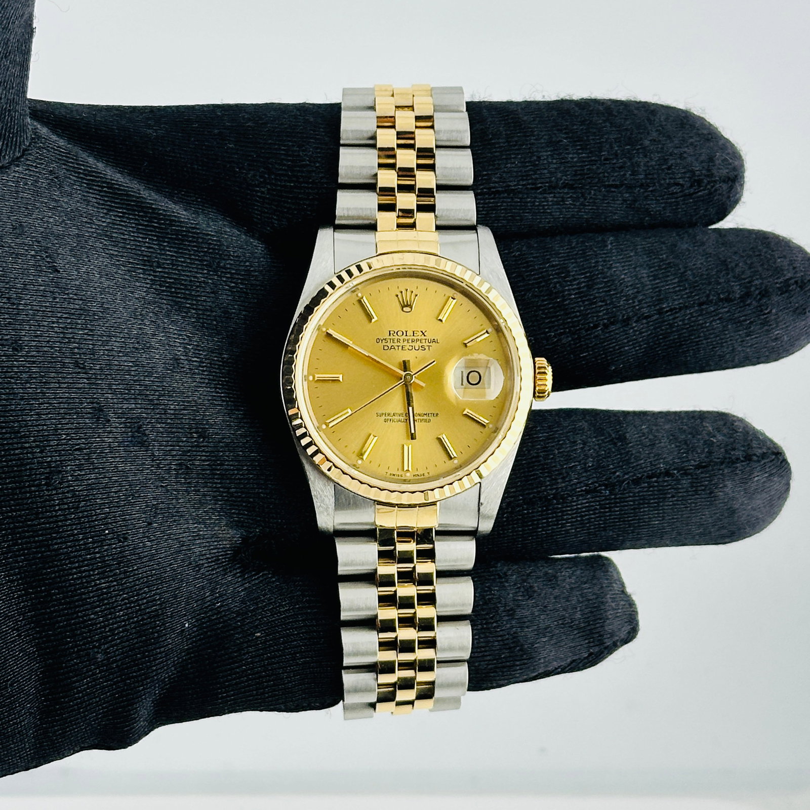 Datejust Ref 16233 Mens Watch Champagne Stick Dial D Link Jubilee: Datejust Ref 16233 Mens Watch Champagne Stick Dial D Link Jubilee This Rolex Datejust features a champagne stick dial, fluted bezel, and a D-Link Jubilee bracelet. It is a men's watch with reference n