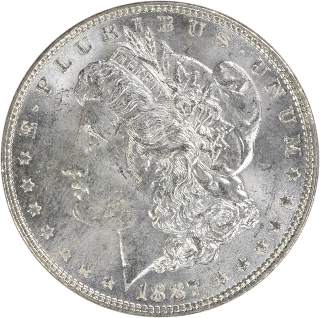 Choice BU 1887 Silver Dollar Morgan Uncertified No Mint Mark: Choice BU 1887 Silver Dollar Morgan Uncertified No Mint Mark This 1887 Morgan Silver Dollar is a Choice Brilliant Uncirculated (BU) coin from the United States. It is uncertified and has no mint mark.