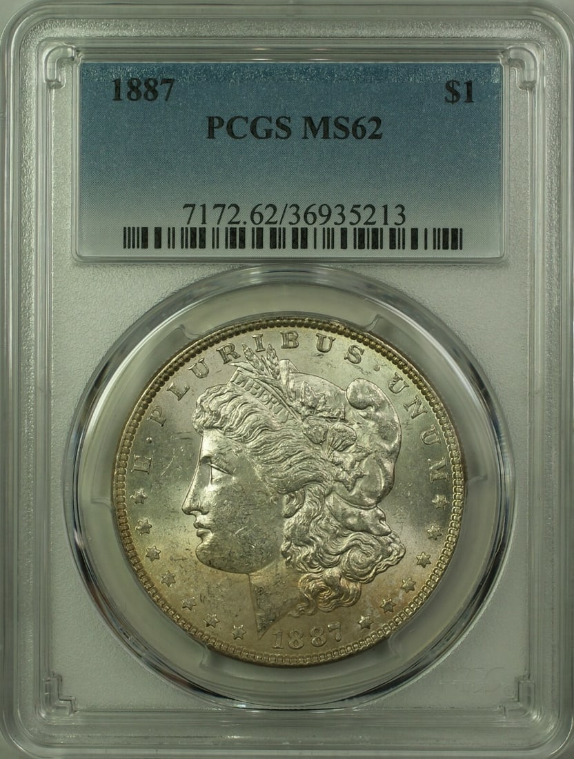 PCGS MS-62 1887 Morgan Dollar Silver $1 Coin Light Toning: PCGS MS-62 1887 Morgan Dollar Silver $1 Coin Light Toning This 1887 Morgan Silver Dollar is a $1 coin from the United States, minted in Philadelphia. It is certified by PCGS with a grade of MS 62 and 
