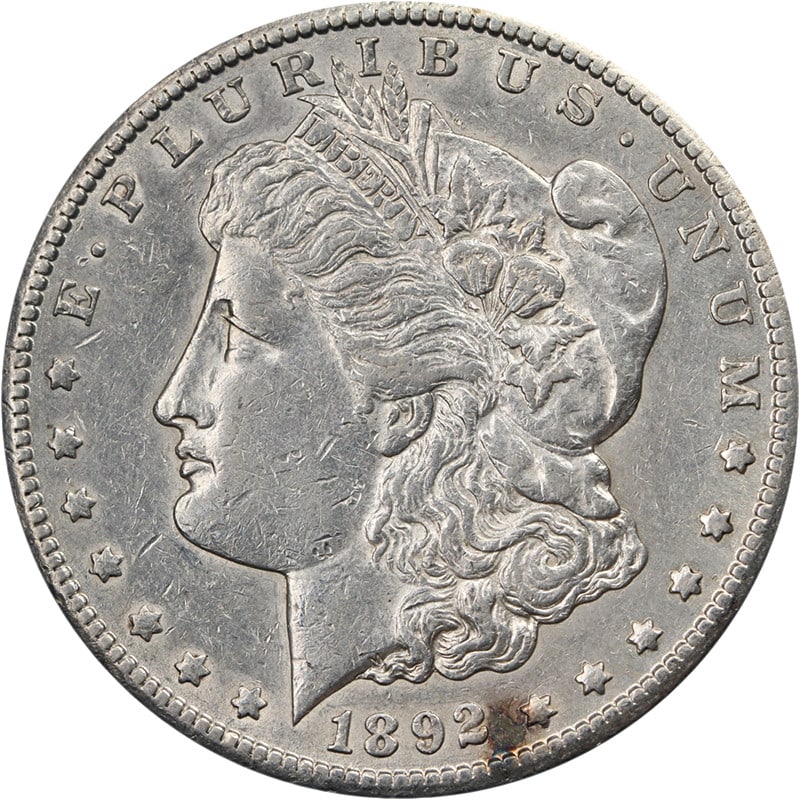 1892 CC Morgan Dollar Silver XF AU Nice Strike: 1892 CC Morgan Dollar Silver XF AU Nice Strike This 1892-CC Morgan Silver Dollar is a circulated coin featuring attractive eye appeal and a well-defined strike. The coin displays nice color and surfac