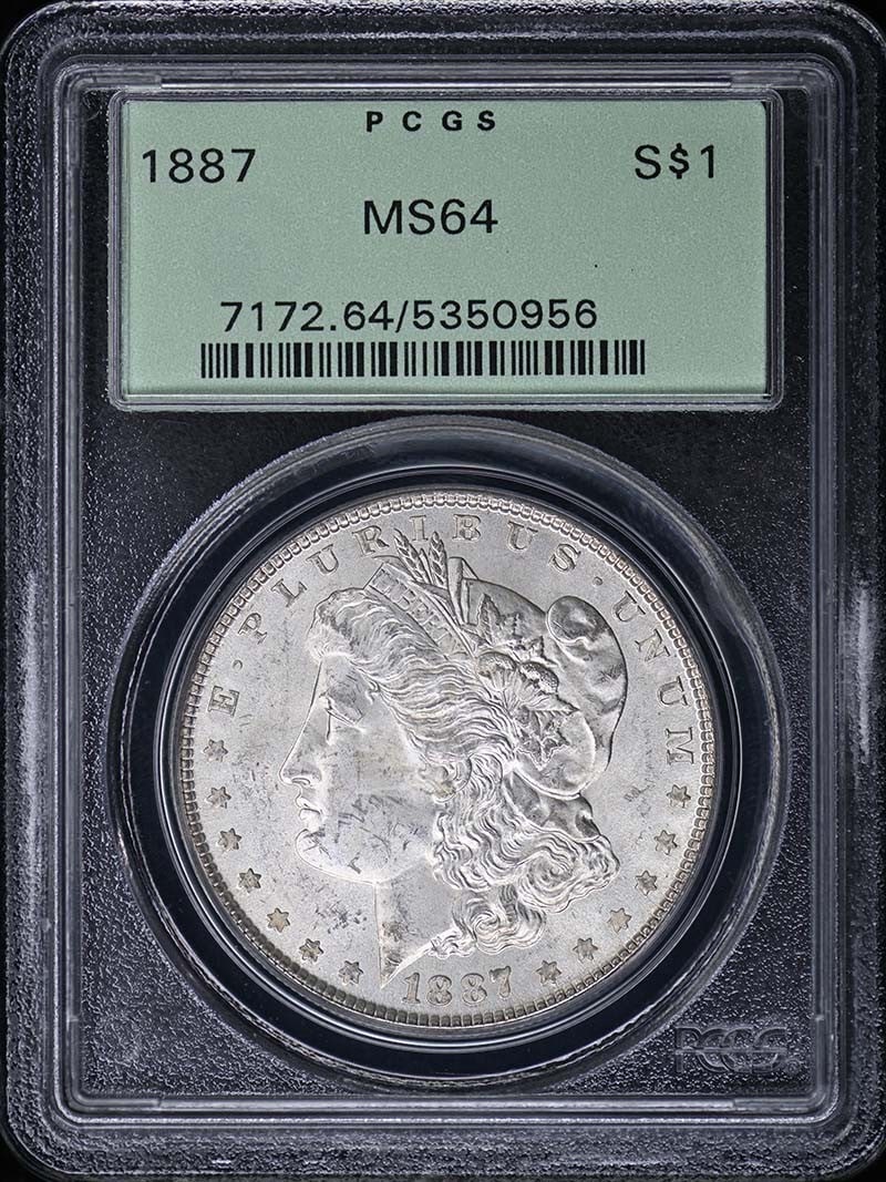 PCGS MS64 1887 Morgan Silver Dollar: PCGS MS64 1887 Morgan Silver Dollar This 1887 Morgan Dollar is graded MS64 by PCGS and comes in an Old Green Holder (OGH). Struck at the Philadelphia Mint, this uncirculated coin is a classic example 