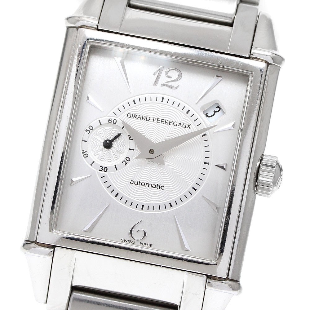 Vintage 1945 Girard Perregaux automatic date men's wristwatch: Vintage 1945 Girard Perregaux automatic date men's wristwatch This Girard Perregaux Vintage 1945 Date men's wristwatch features a stainless steel case and band with a beige dial. The watch is powered 