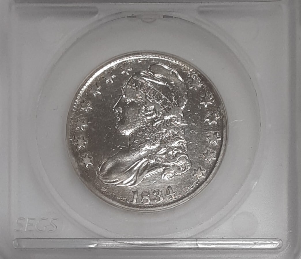 1834 Capped Bust Half Dollar Silver Coin Extra Fine Details Damaged Cleaned: 1834 Capped Bust Half Dollar Silver Coin Extra Fine Details Damaged Cleaned This is an 1834 Capped Bust Silver Half Dollar coin from the United States, featuring a denomination of 50 cents. The coin i