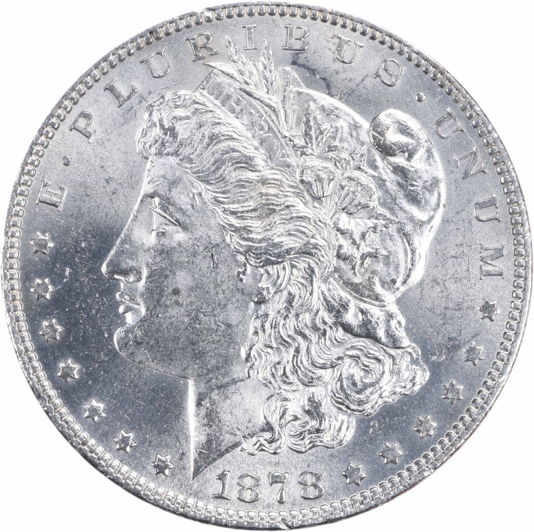 Uncirculated 1878 Morgan Dollar BU 7 Tail Feathers Reverse of 1879 Silver Coin: Uncirculated 1878 Morgan Dollar BU 7 Tail Feathers Reverse of 1879 Silver Coin This is an uncirculated 1878 Morgan Silver Dollar featuring the 7 Tail Feathers (7TF) Reverse of 1879. The coin is compos