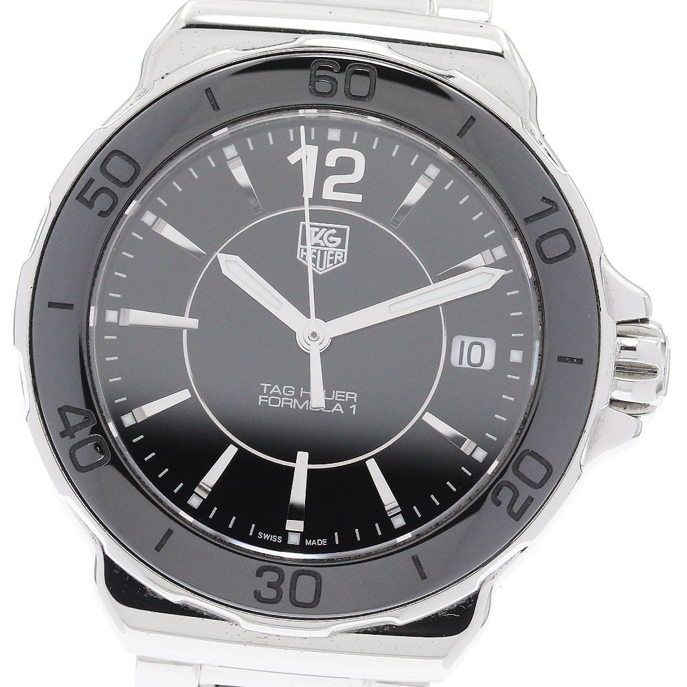 TAG Heuer Formula 1 WAH1210 Quartz Date Womens Wristwatch: TAG Heuer Formula 1 WAH1210 Quartz Date Womens Wristwatch This TAG Heuer Formula 1 WAH1210 is a women's quartz wristwatch featuring a black dial and a combination of stainless steel and ceramic for bo