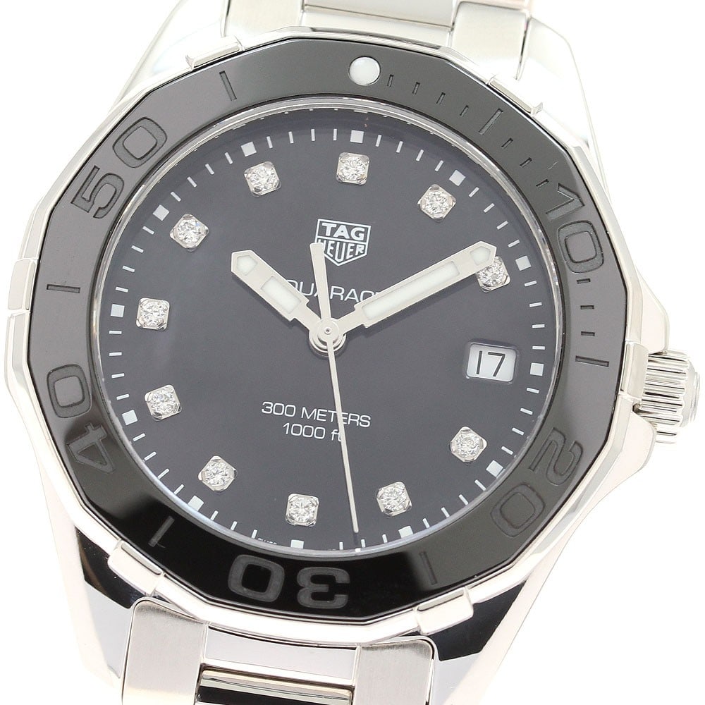 TAG Heuer Aquaracer Quartz Diamond Date Women's Watch: TAG Heuer Aquaracer Quartz Diamond Date Women's Watch This TAG HEUER Way131M Aquaracer is a women's wristwatch featuring a quartz movement and a date display. The watch is adorned with 11 diamond hour