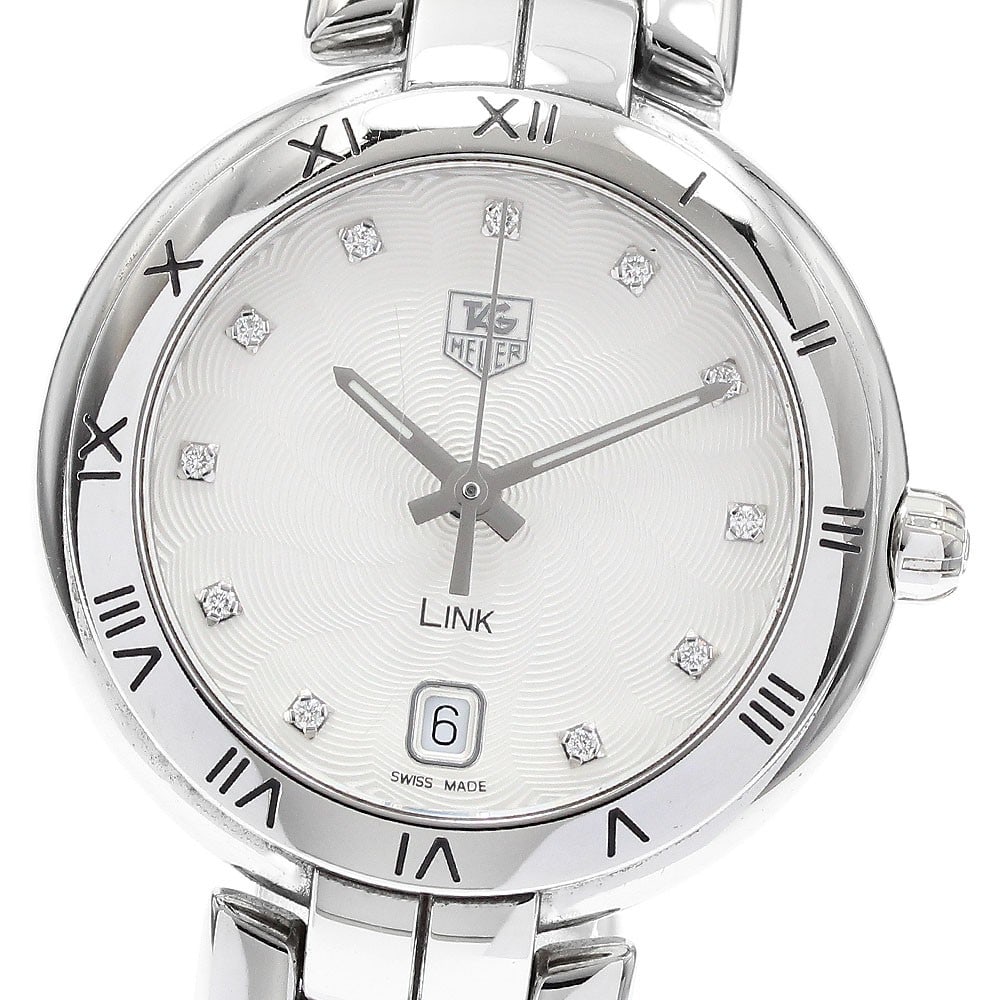 Tag Heuer Link WAT1311 Quartz Date Stainless Steel Watch: Tag Heuer Link WAT1311 Quartz Date Stainless Steel Watch This TAG Heuer Link women's wristwatch features a stainless steel case and bracelet, complemented by a silver dial set with 11 diamonds. The wa