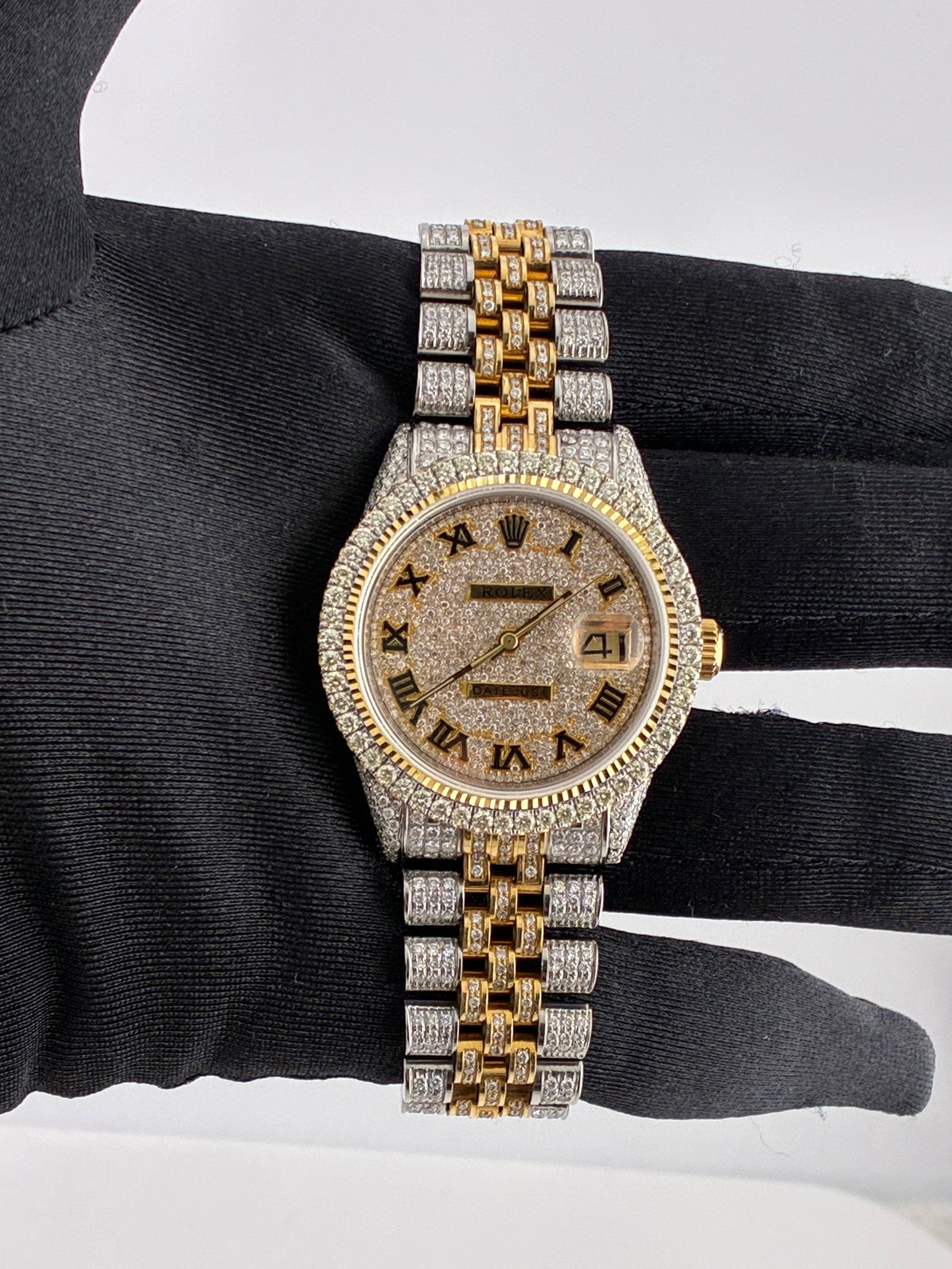 Rolex Datejust Ref 1601 Mens Watch Diamond Roman Dial Aftermarket Jubilee Bracelet: Rolex Datejust Ref 1601 Mens Watch Diamond Roman Dial Aftermarket Jubilee Bracelet This Rolex Datejust features a diamond Roman numeral dial and a diamond-set bezel. The watch comes with an aftermarke