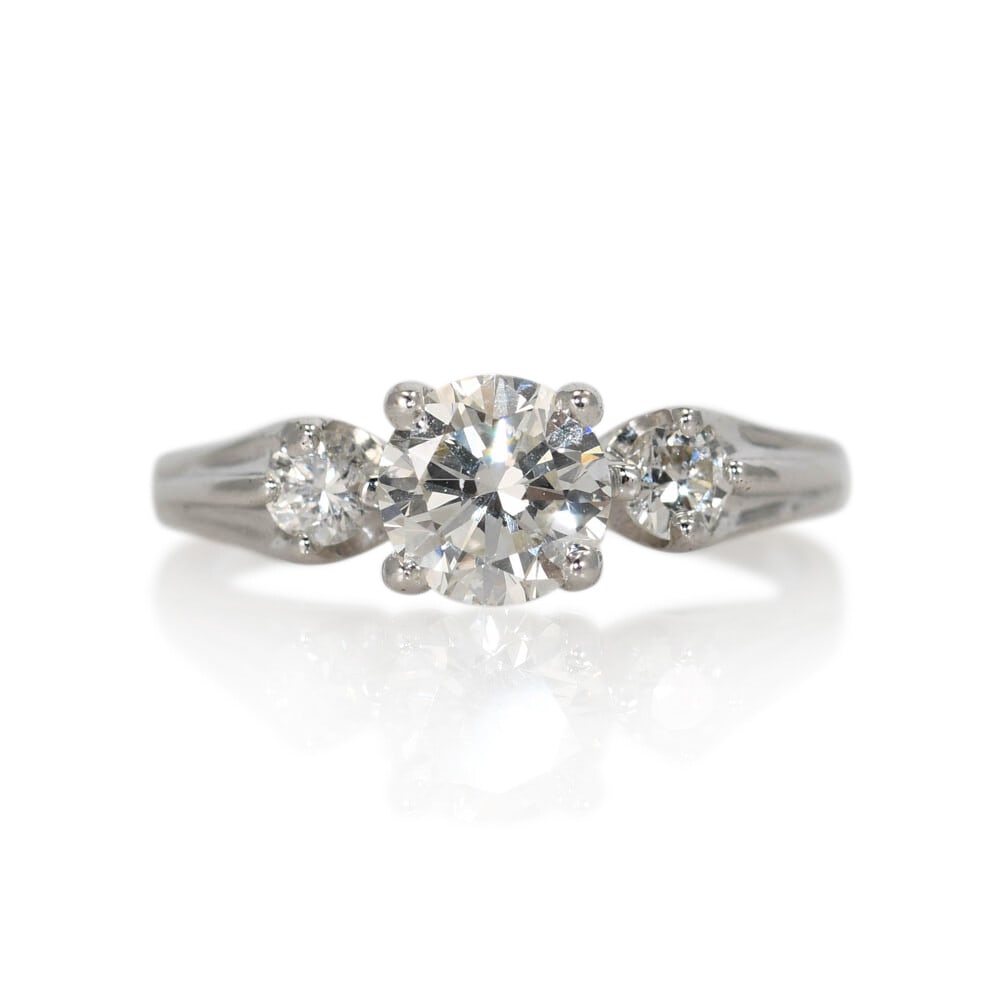 3 Diamond 14K White Gold Engagement Ring Size 5.375: 3 Diamond 14K White Gold Engagement Ring Size 5.375 This ladies' diamond engagement ring features a 0.75 carat round brilliant cut center diamond set in a 14K white gold setting. The center diamond is