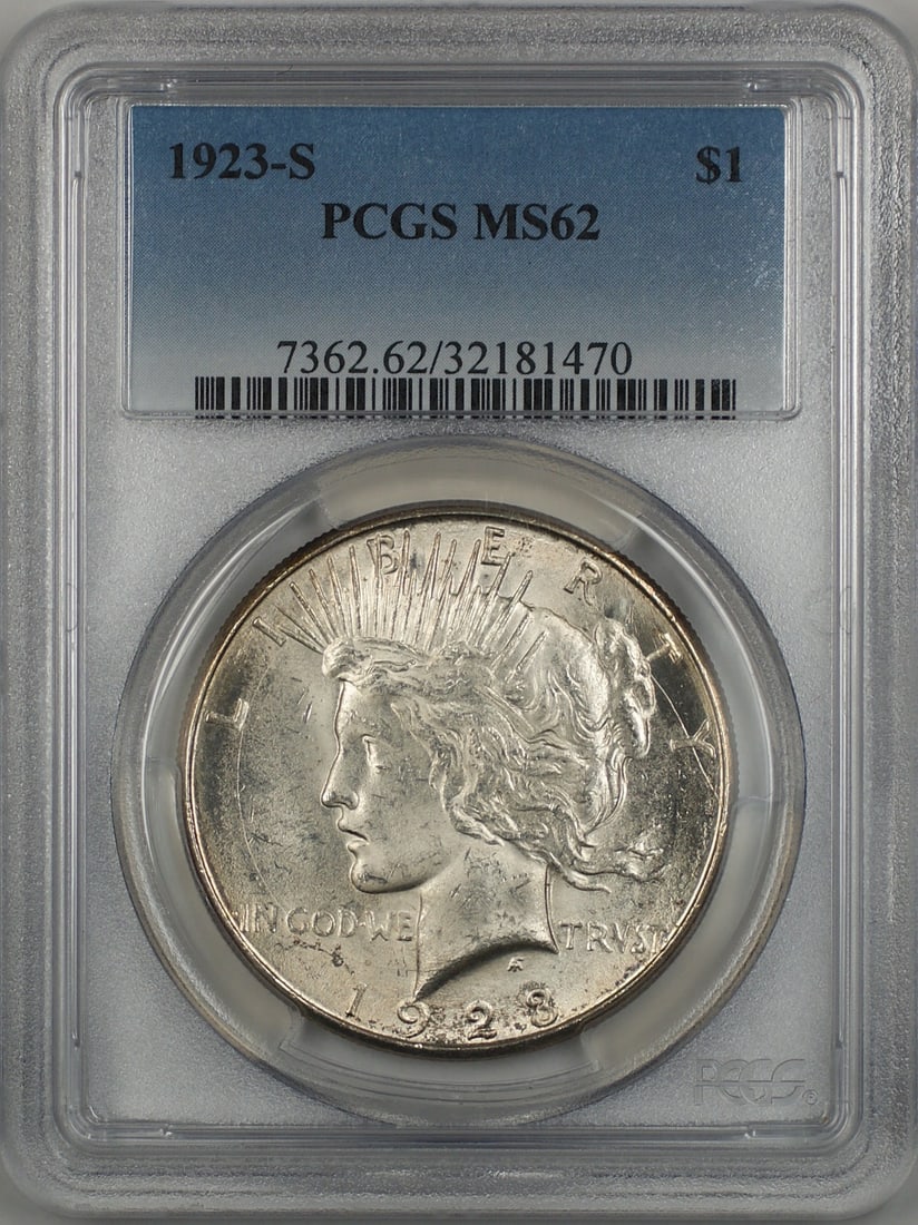 1923-S Peace Dollar Silver Coin with Obverse Circular Die Break PCGS MS62: 1923-S Peace Dollar Silver Coin with Obverse Circular Die Break PCGS MS62 This 1923-S Peace Dollar features a circular die break on the obverse, located just under the 'L' in 'Liberty.' Certified by P