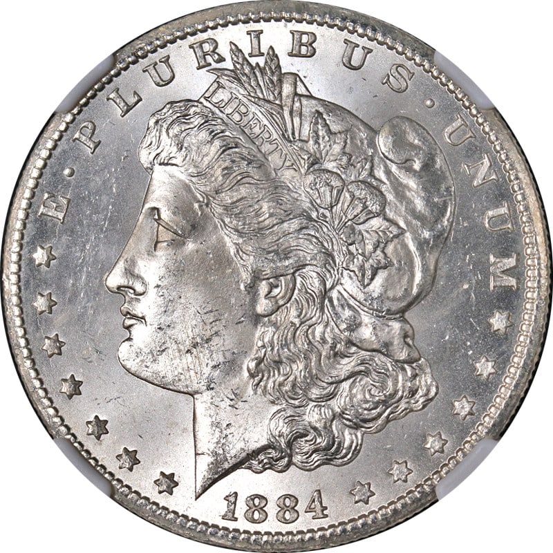 1884-CC Morgan Silver Dollar NGC MS63 Blast White Uncirculated: 1884-CC Morgan Silver Dollar NGC MS63 Blast White Uncirculated This stunning 1884-CC Morgan Silver Dollar is certified by NGC with a grade of MS63, showcasing superb eye appeal. The coin features a bl