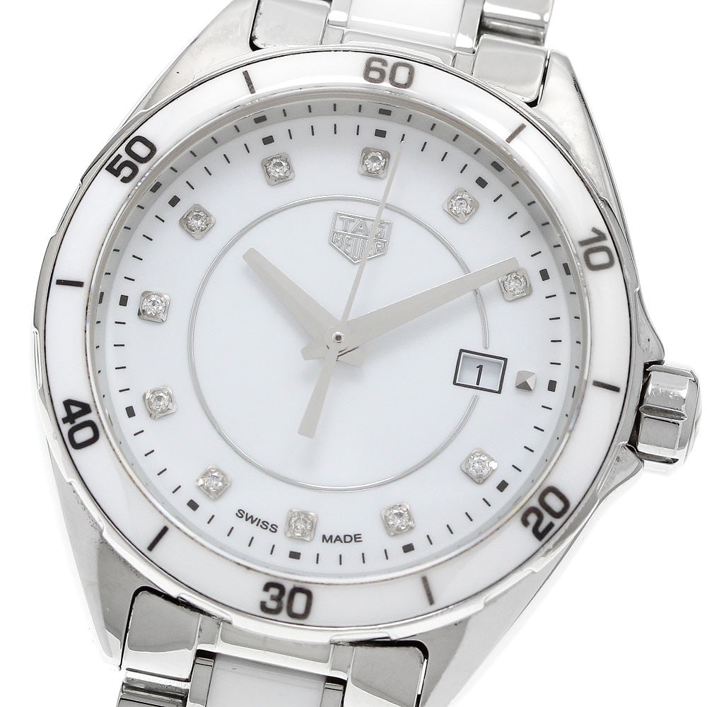 TAG Heuer Formula 1 Quartz Date White Dial Women's Watch: TAG Heuer Formula 1 Quartz Date White Dial Women's Watch This TAG Heuer Formula 1 women's wristwatch features a stainless steel and ceramic case and band, complemented by a white dial adorned with 11 