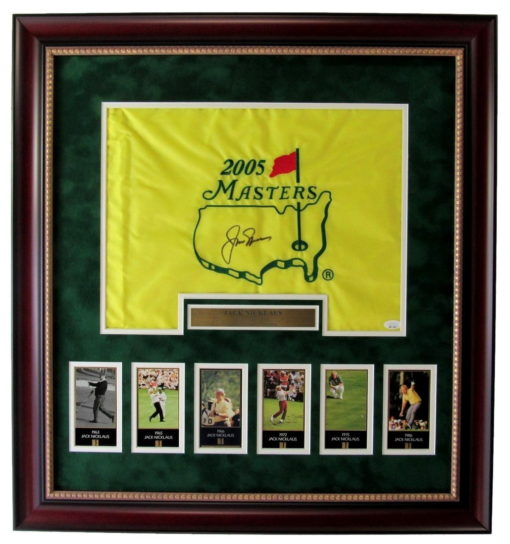 Framed Jack Nicklaus Masters pin flag with photo collage JSA LOA: Framed Jack Nicklaus Masters pin flag with photo collage JSA LOA This framed display features a Jack Nicklaus autographed 2005 Masters pin flag, accompanied by a trading card collage. The item is auth