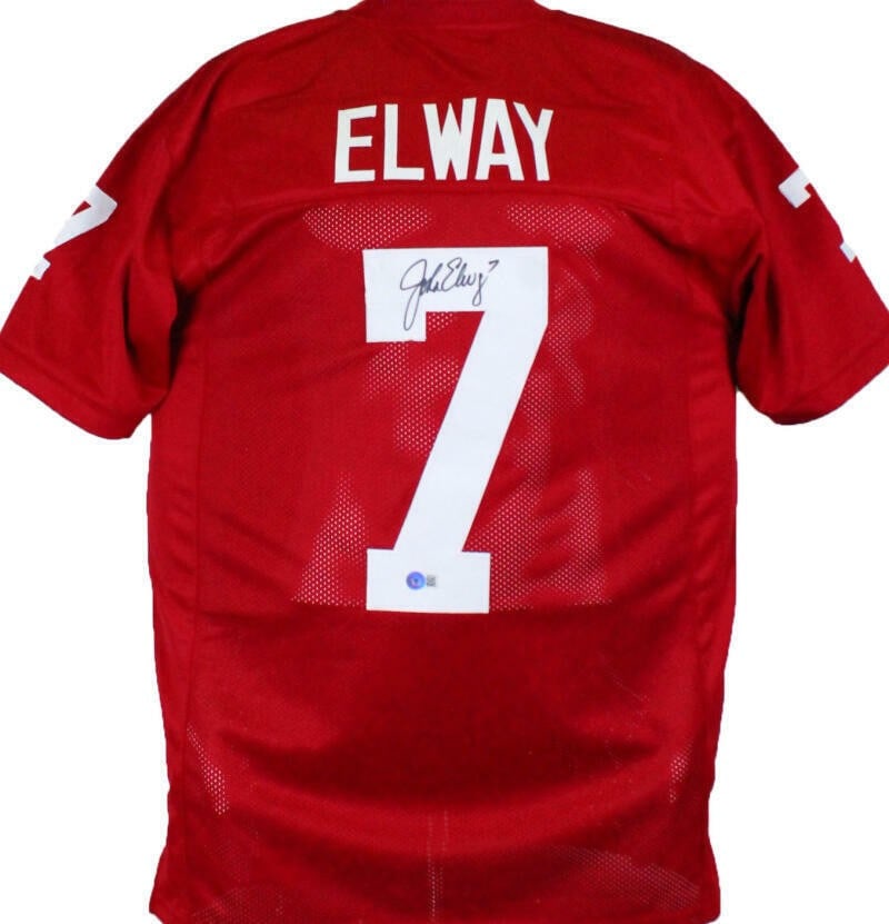 Stanford Cardinal John Elway Signed Red Jersey Beckett Hologram: Stanford Cardinal John Elway Signed Red Jersey Beckett Hologram Autographed John Elway jersey in a red college-style design representing the Stanford Cardinal. The item is listed as original and is pr