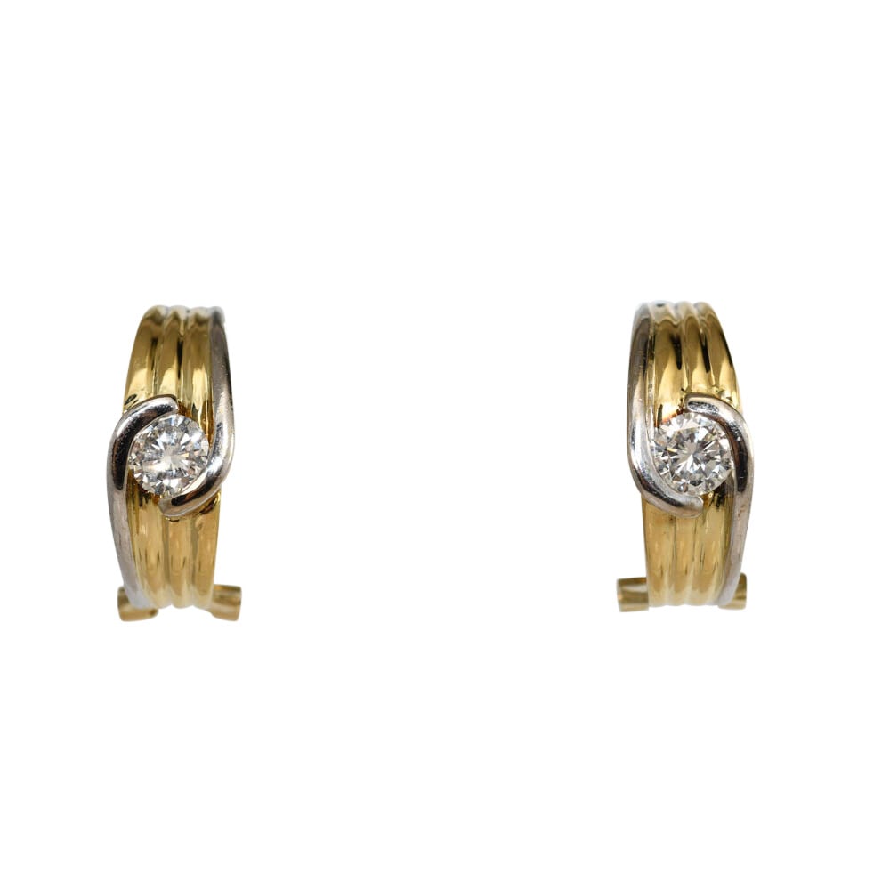 18K Two Tone Diamond Hoop Earrings 0.80 ctw 11.6g: 18K Two Tone Diamond Hoop Earrings 0.80 ctw 11.6g These elegant hoop earrings are crafted from 18K two-tone gold and feature two round brilliant cut natural diamonds totaling 0.80 carats. The diamonds
