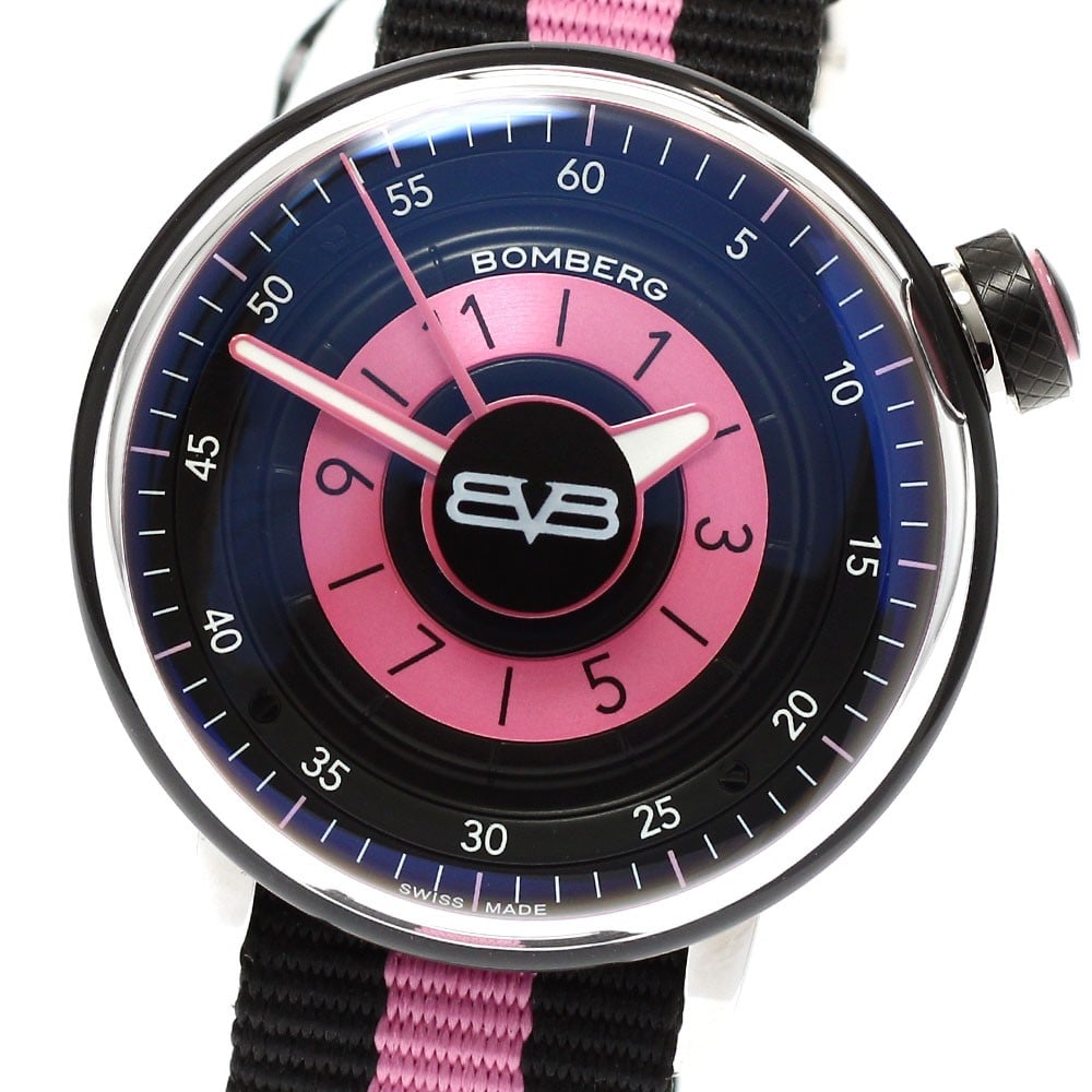 BOMBERG BB-01 quartz women s wristwatch 38mm stainless steel: BOMBERG BB-01 quartz women s wristwatch 38mm stainless steel This BOMBERG BB-01 women's wristwatch features a stainless steel case paired with a nylon strap. The watch showcases a striking pink and bl