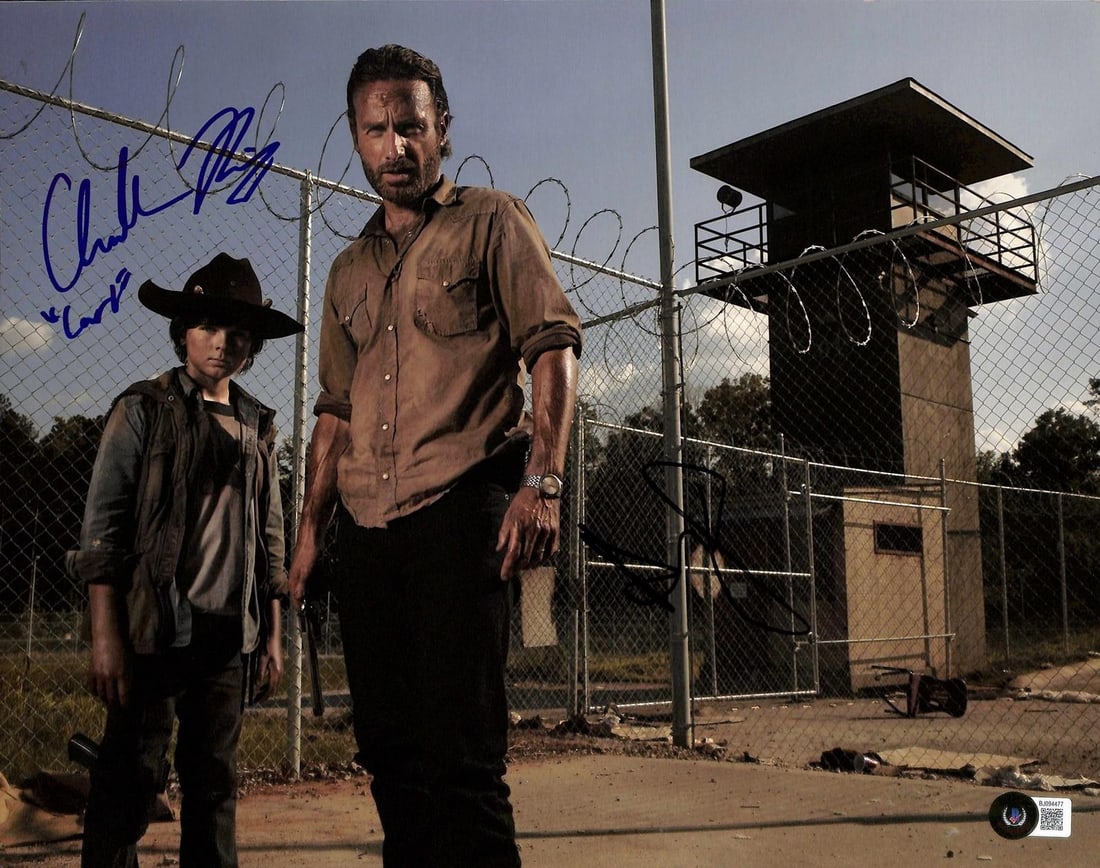 Beckett Certified Walking Dead 11x14 Photo Signed by Lincoln and Riggs: Beckett Certified Walking Dead 11x14 Photo Signed by Lincoln and Riggs This 11x14 photograph from AMC's The Walking Dead is hand-signed by Andrew Lincoln and inscribed by Chandler Riggs, who played Ri