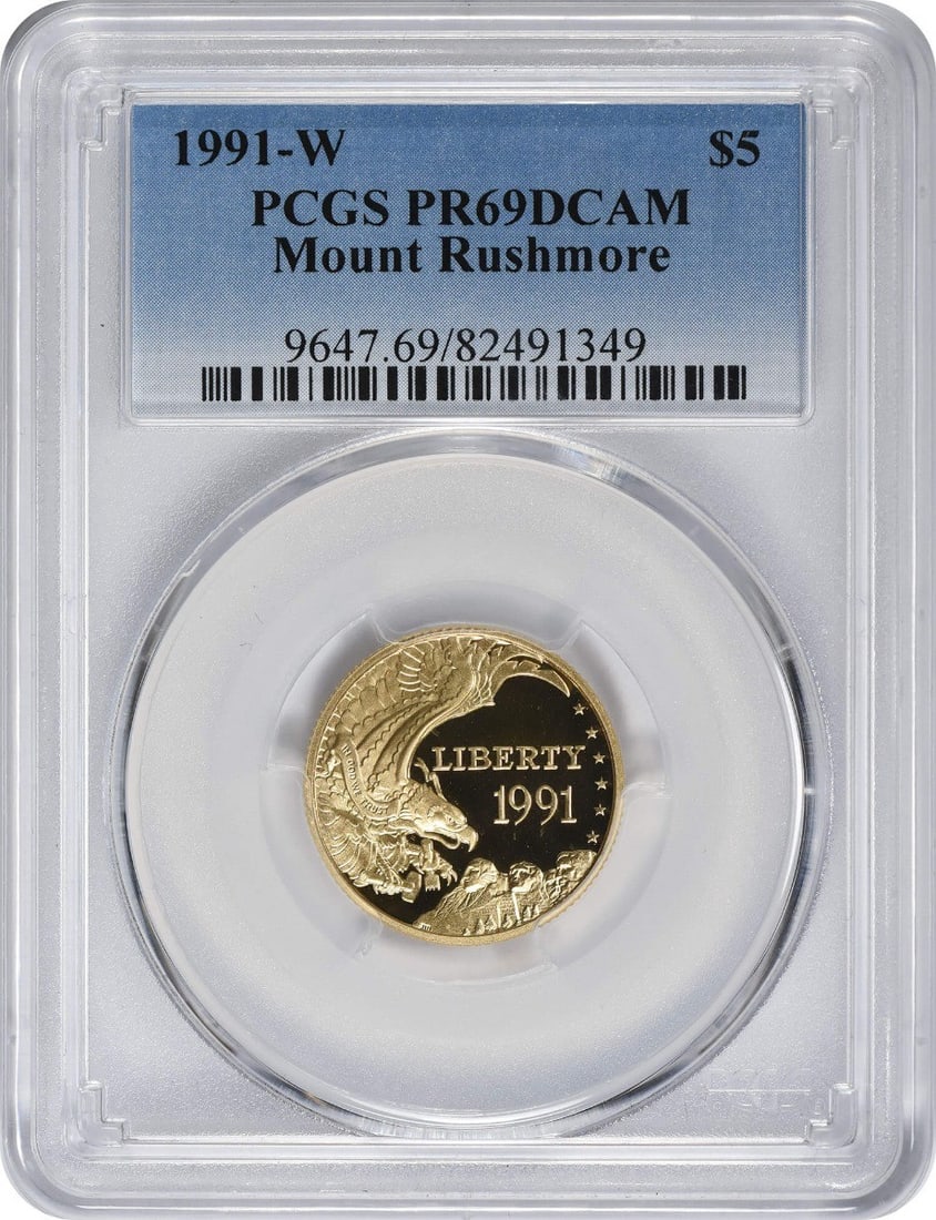 PCGS PR69DCAM 1991-W Mount Rushmore $5 Gold Proof Coin: PCGS PR69DCAM 1991-W Mount Rushmore $5 Gold Proof Coin This 1991-W Mount Rushmore Commemorative $5 gold coin is a proof strike, graded PR69DCAM by PCGS. Issued by the United States Mint, it features a