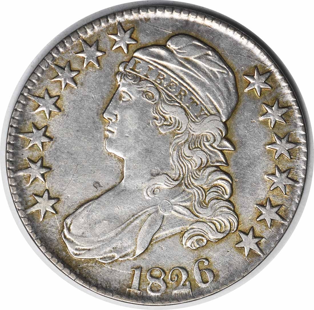 1826 Bust Half Dollar AU John Reich Design 50C Silver Coin: 1826 Bust Half Dollar AU John Reich Design 50C Silver Coin This 1826 Bust Half Dollar is an exquisite piece of numismatic history, featuring a design by John Reich. The coin is in About Uncirculated (